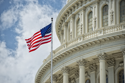 Washington DC Capitol dome detail with waving american flag